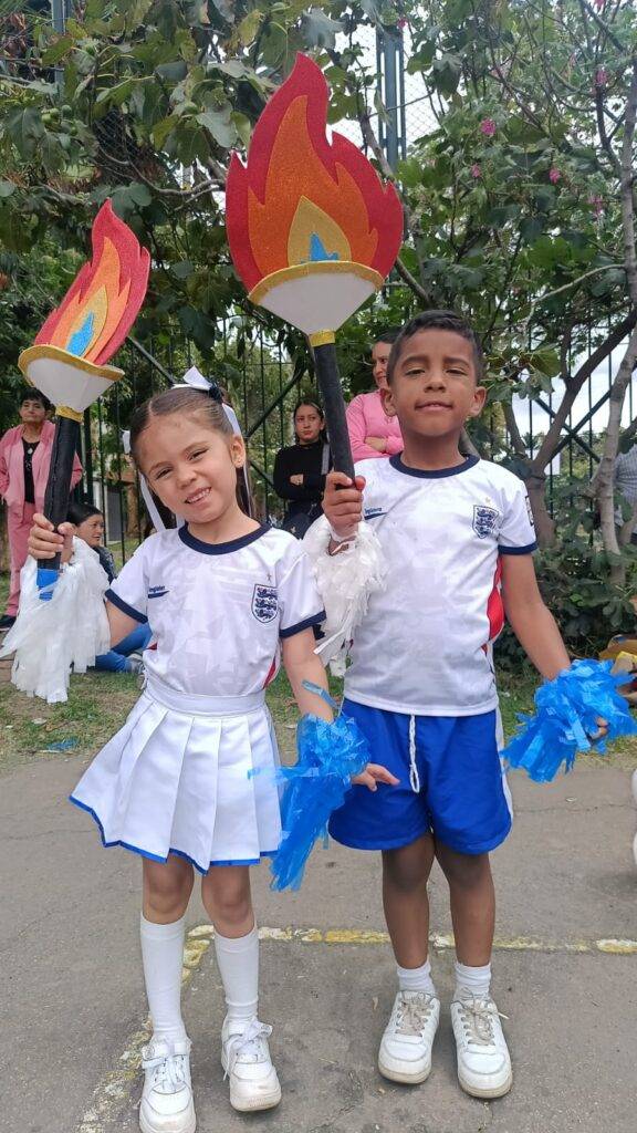 Colegio cooperativo nuevo muzu 2026 inauguración juegos deportivos con la llama olímpica